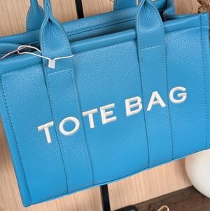 Sky Blue Tote Bag With Crossbody Strap Included.